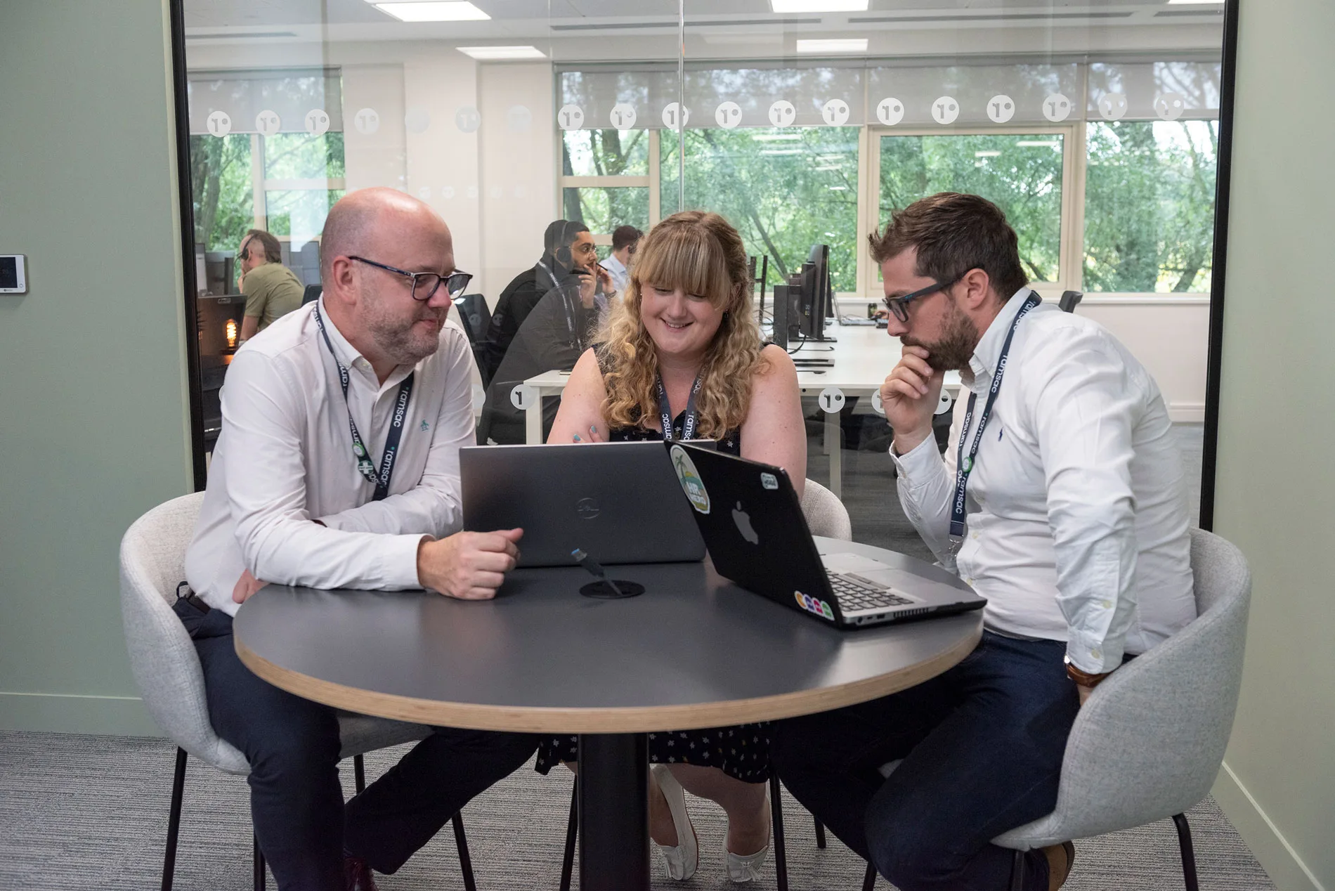 three people of the team working together
